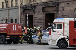 Emergency services personnel walk at the entrance to Technological Institute metro station in Saint Petersburg on April 3, 2017. Around 10 people were feared dead and dozens injured Monday after an explosion rocked the metro system in Russia's second city Saint Petersburg, according to authorities, who were not ruling out a terror attack. / AFP PHOTO / Olga MALTSEVA